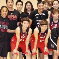 South Carolina women’s basketball team head coach Dawn Staley (second from left) poses for a photo with her players and Japanese players after their scrimmage on Tuesday in Tokyo. Staley pleased with South Carolina's play against Japan