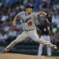 Dodgers starter Kenta Maeda pitches against the White Sox on Wednesday night. Dodgers extend win streak to 11 by trouncing White Sox