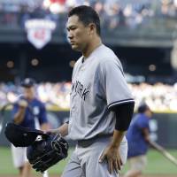 Yankees starter Masahiro Tanaka leaves the field after the third inning on Saturday in Seattle. The Yankees lost 6-5 against the Mariners. Mariners rough up Tanaka, top Yankees in 10