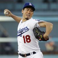 Dodgers starter Kenta Maeda pitches against the Twins on Tuesday at Dodger Stadium in Los Angeles. The Dodgers won 6-2. Maeda's solid outing helps Dodgers top Twins