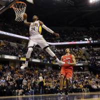 The Indiana Pacers have traded All-Star forward Paul George, seen here dunking in 2014, to the Oklahoma City Thunder for Victor Oladipo and Domantas Sabonis. Pacers trade George to Thunder