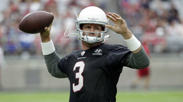 Cardinals quarterback Carson Palmer throws a pass on the first day of training camp on Saturday in Glendale, Arizona. Rejuvenated Cardinals QB Palmer eager to get going