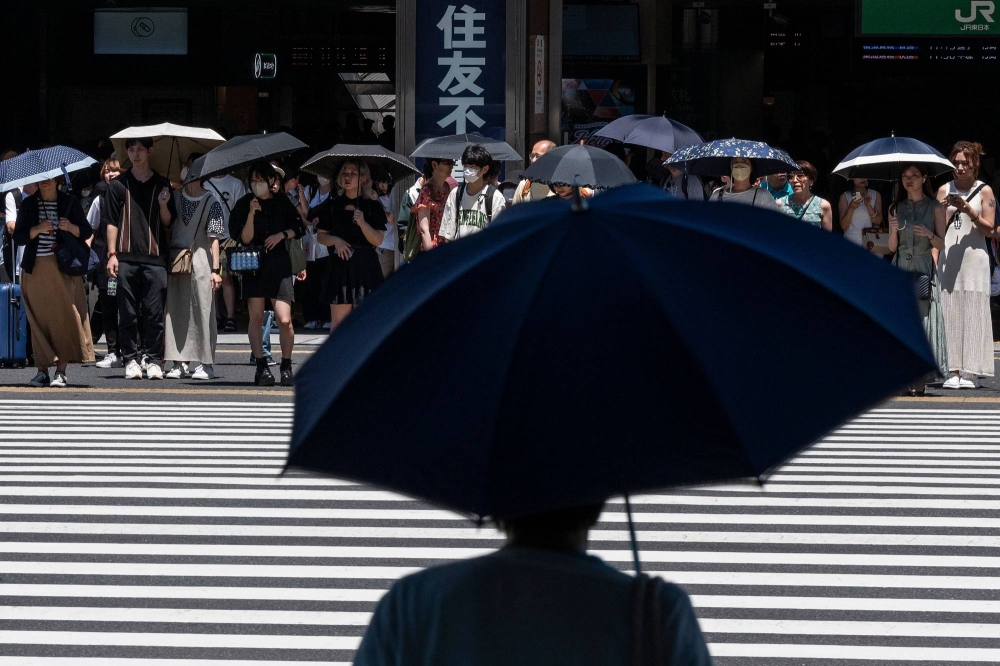 Cities near Tokyo mark 'summer' weather with record high