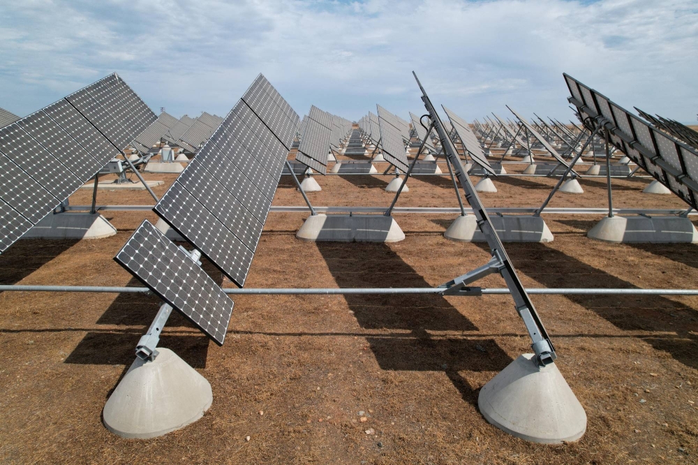 Japanese contractors install solar panels on the Public Works building roof  at Fleet Activities Sasebo, Japan