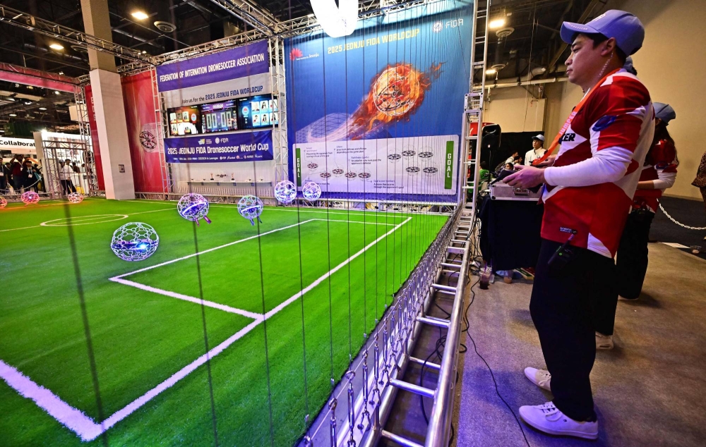 Buzz, bump, goal! Drone soccer aims high at CES - The Japan Times