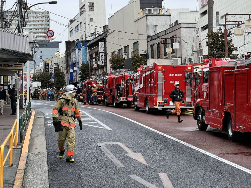 Fire near train station in Tokyo halts key transportation corridor