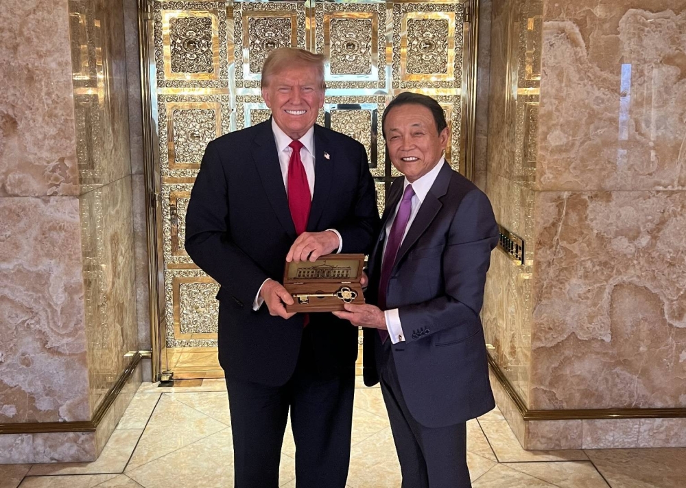 Former Japanese Prime Minister Aso discusses security and economy with President Trump
