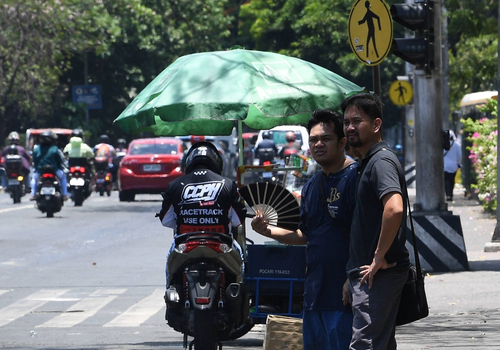 Extreme heat scorched the Philippines on Wednesday, forcing thousands of schools to suspend in-person classes and prompting warnings for people to lim