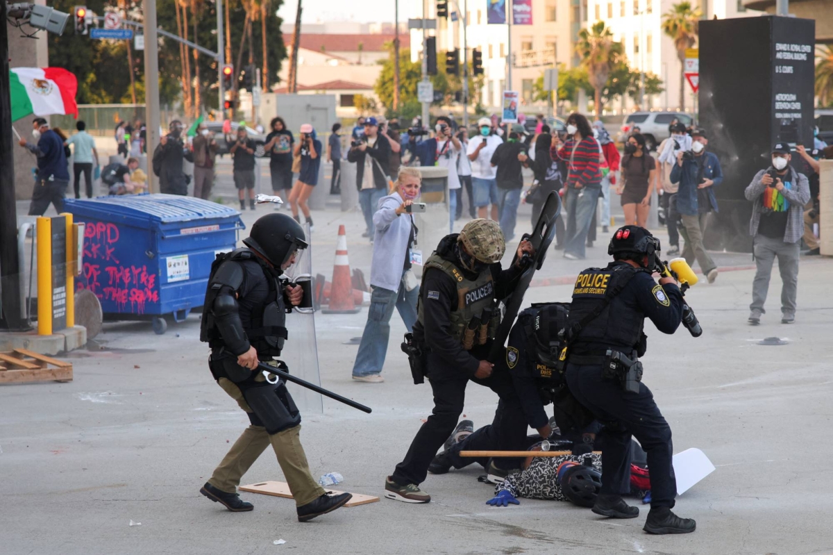Rifles, stun grenades, armored trucks in ICE raids spur tensions