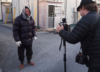 A Shinchi resident poses for Peterson's 'magic camera.'