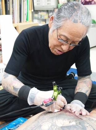 Master at work: Horiyoshi III works at his studio in Yokohama.