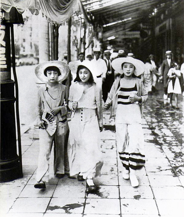 Young moga (modern girls) walk down a Ginza street in 1928 dressed in 'Beach Pyjama Style.'  | KAGEYAMA KOYO