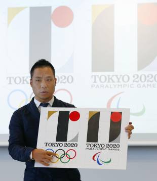 Kenjiro Sano, designer of the main 2020 Tokyo Olympics logo (left), denies plagiarism in Tokyo on Aug. 5. | KYODO
