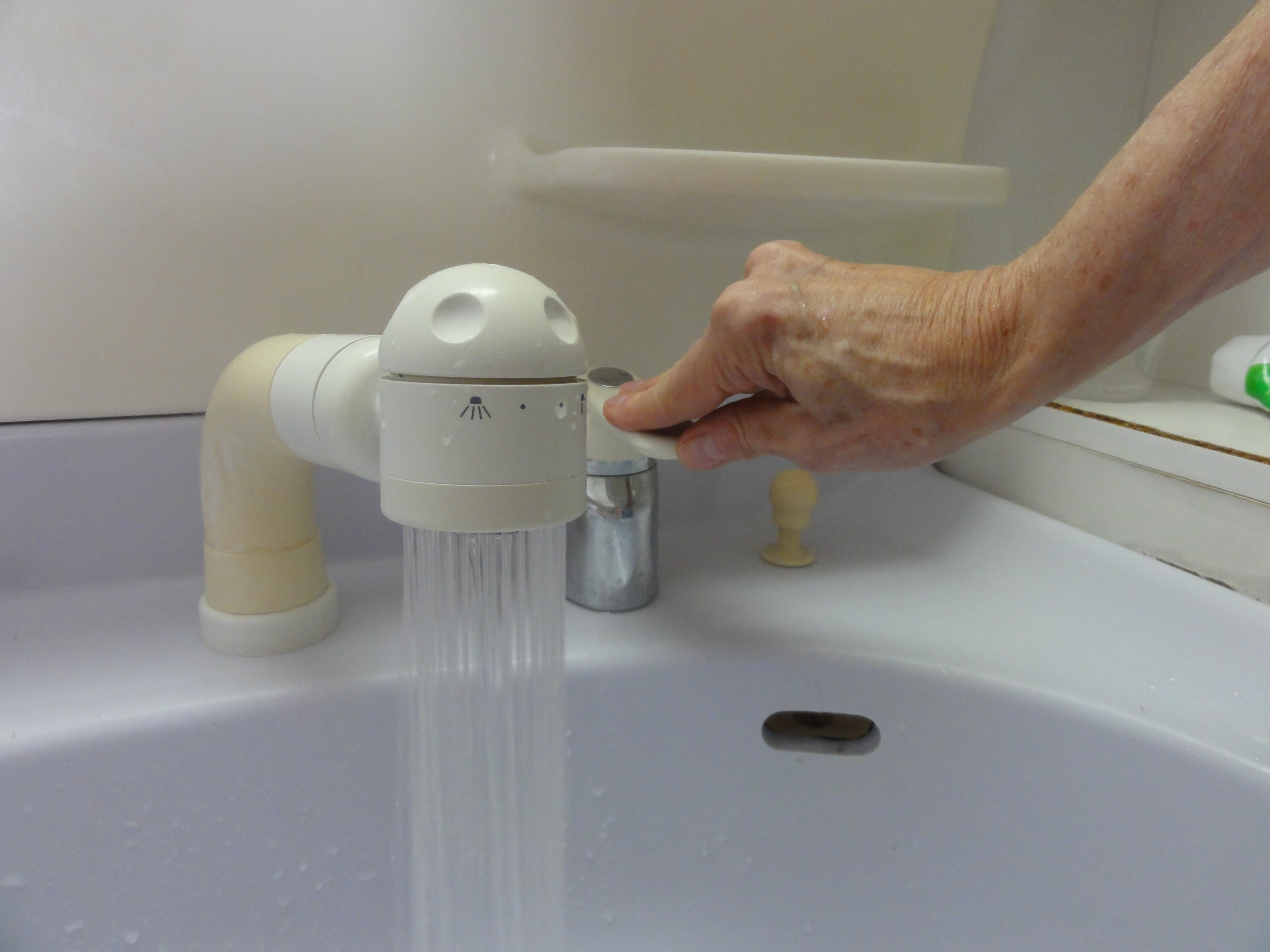 Going down: An age-tome (lift to stop) faucet has to be pushed down to start the water flow and lifted up to stop it.