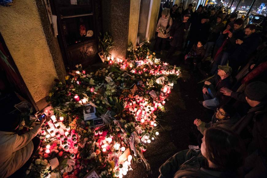 Crowds gather during a wake outside David Bowie