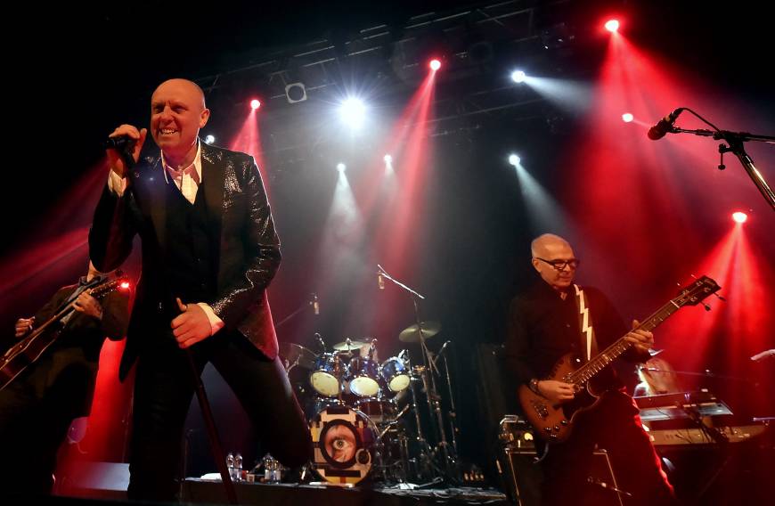 Glenn Gregory, left, drummer Mick Woodmansey, and fellow collaborator with David Bowie, Tony Visconti, right, perform as the group Holy Holy, at a tribute show to Bowie.