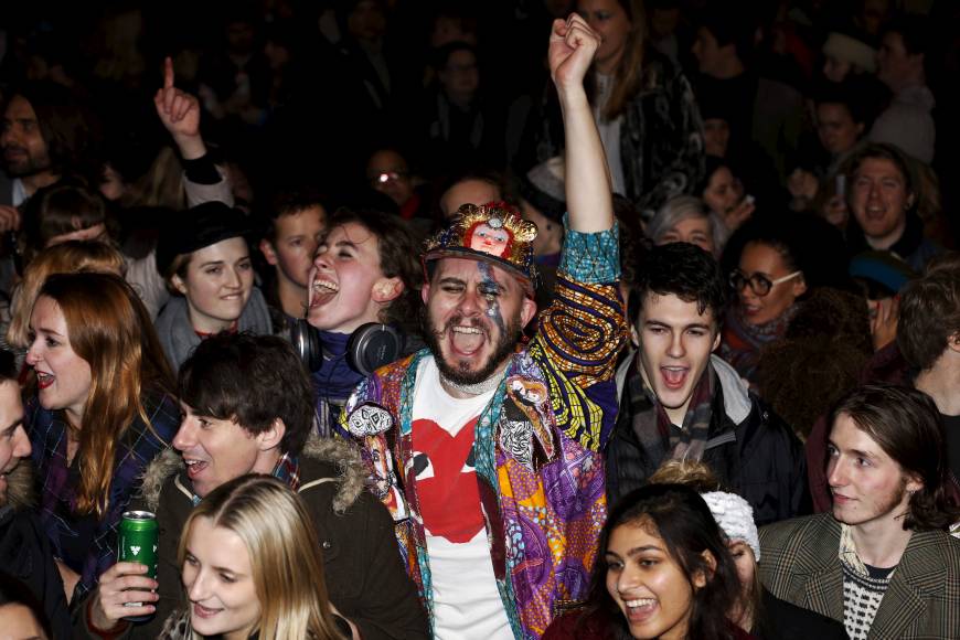 Crowds gather in his birthplace of Brixton, South London on Monday night to celebrate the life.