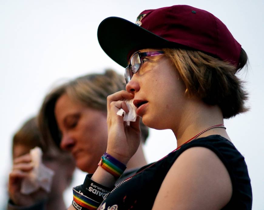 Phoebe Darr, 14, tears up at a vigil in Eau Claire, Wisconsin.