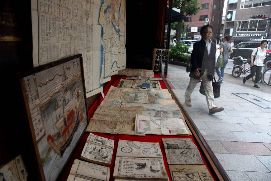 Old maps, ukiyo-e woodblock prints and books from the Edo Period are among valuable antiquarian items offered at the Oya bookstore in Tokyo’s Jinbocho district.