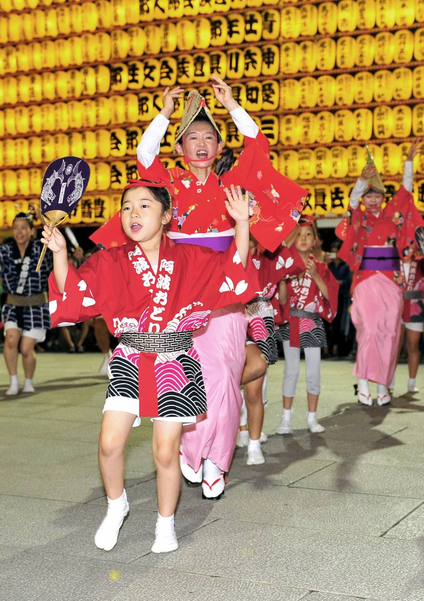 Children and adults perform the Awa odori dance at the Mitama Matsuri festival at Yasukuni Shrine in Tokyo