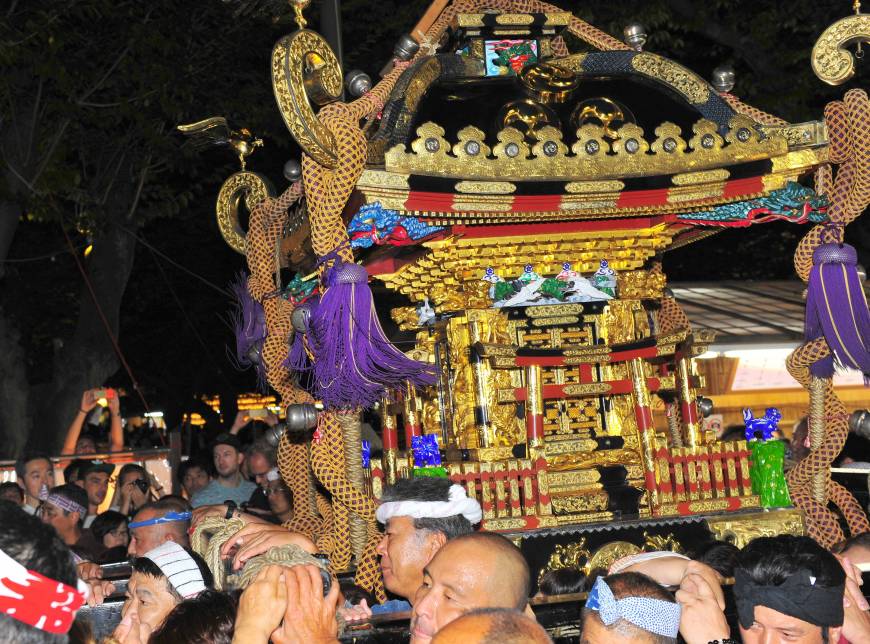 Men carry a mikoshi portable shrine as they parade during the Mitama Matsuri at Yasukuni Shrine in Chiyoda Ward, Tokyo, on July 16.