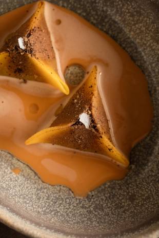 Stylish seafood: Langoustine and squash dim sum dumpings are bathed in a creamy seafood bisque at Hertog Jan.