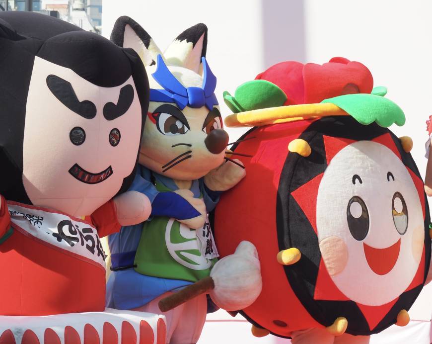 Among the visiting dignitaries at the opening ceremony of the Tohoku Rokkon Festival Parade were sundry mascots from Japan