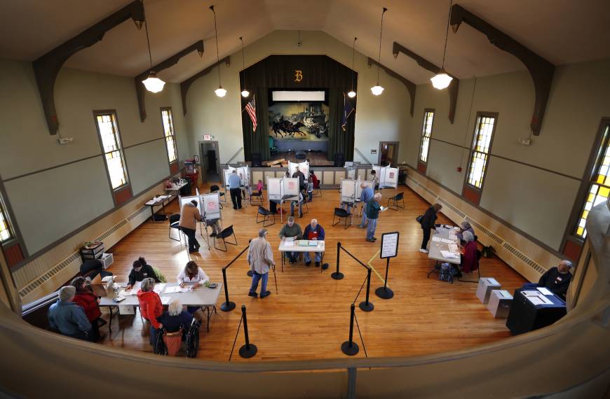 Voters cast their ballots at historic Holley Hall in Bristol, Vermont.