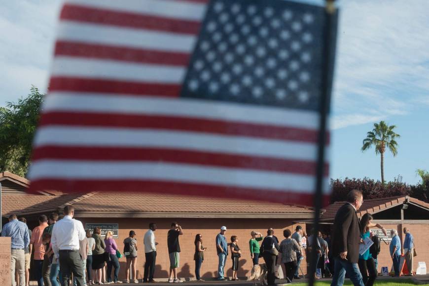 Voters wait in line to cast their ballots in Scottsdale, Arizona.