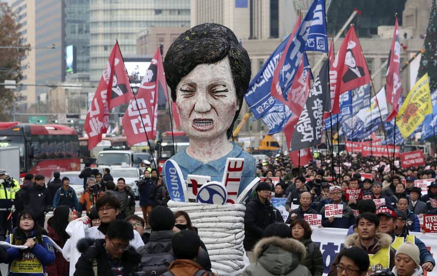 Protesters carry an effigy of South Korean President Park Geun-hye in Seoul.