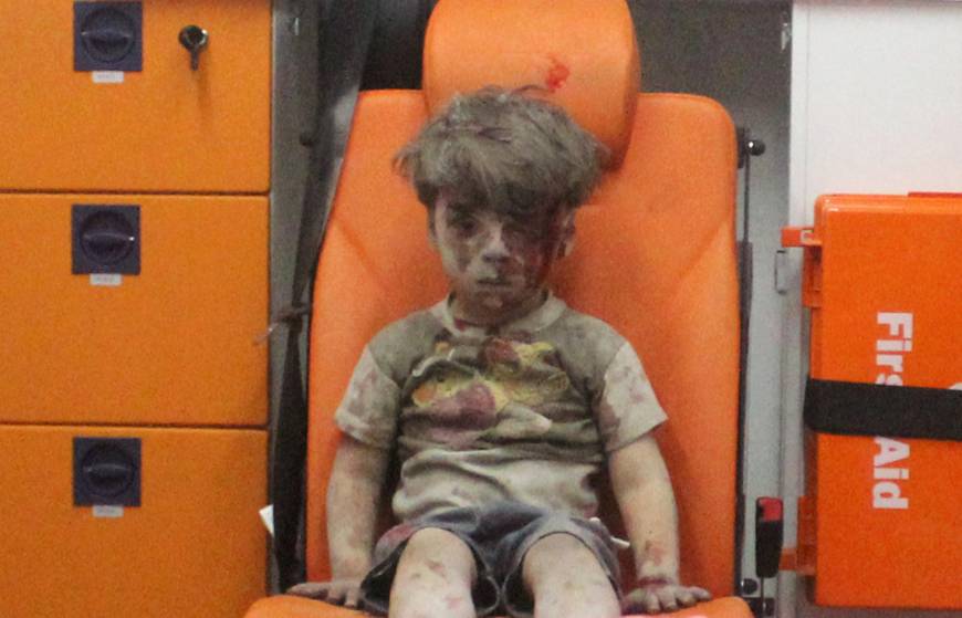 Five-year-old Omran Daqneesh sits in an ambulance after he was rescued following an airstrike on his home in Aleppo, Syria.