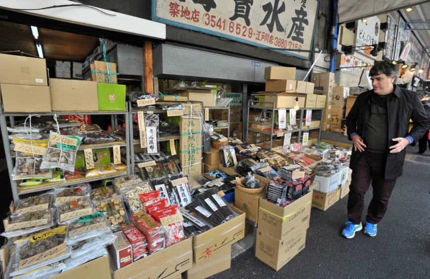 A tourist browses a dry foods store in Tsukiji, Tokyo.