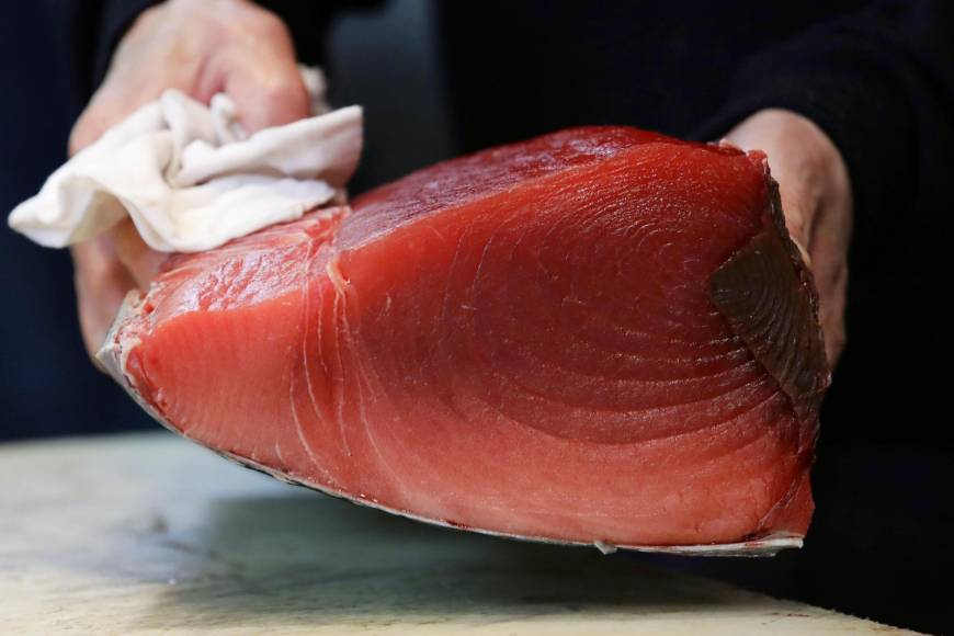 Wholesalers cut tuna in blocs before selling them to sushi restaurants or other customers.