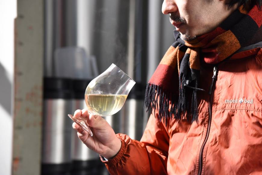 Koichi Fujita, a beer manager for the Brussels group bars, samples the early stages of Haru no Ibuki. 