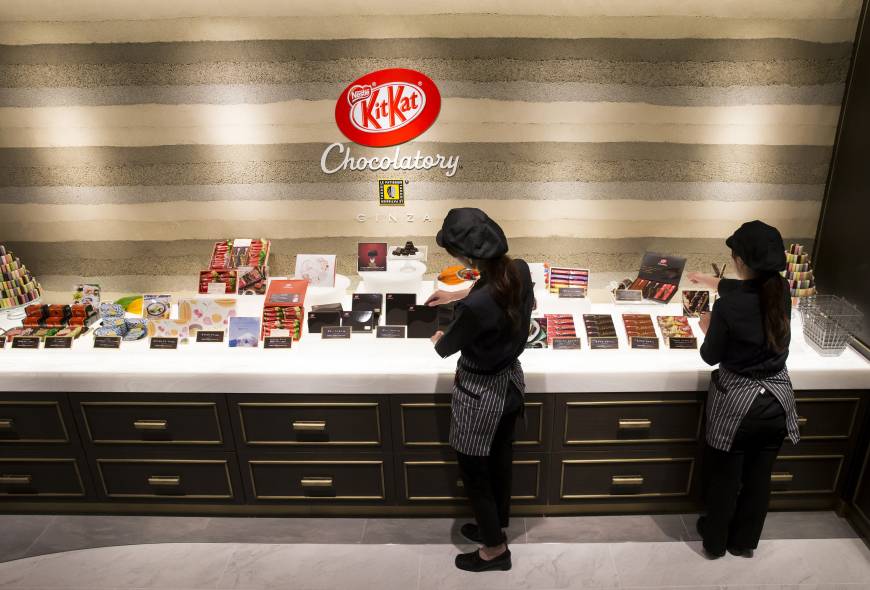 Employees arrange Kit Kat products at the Kit Kat Chocolatory Ginza store in Tokyo on July 24.