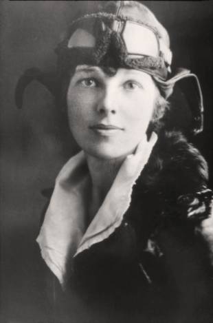 U.S. aviatrix Amelia Earhart poses for a portrait in her flying gear in an undated photograph.