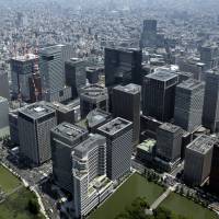 Commercial buildings stand in the Marunouchi and Otemachi districts in central Tokyo. | BLOOMBERG