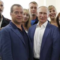 Russian President Vladimir Putin and Russian Prime Minister Dmitry Medvedev are seen together during their visit to Sevastopol, Crimea, on Aug. 18. | AP