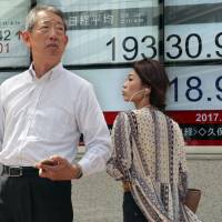 Asian shares were mostly lower Tuesday as the region was rattled by a North Korean missile test in which the projectile flew over Hokkaido. | AP