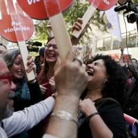 Women celebrate after learning that Chile\'s Constitutional Court will uphold a measure that would end the country\'s absolute ban on abortions, in Santiago Monday. The court\'s vote accepts the constitutionality of a measure to legalize abortions when a woman\'s life is in danger, when a fetus is not viable and in cases of rape. | AP