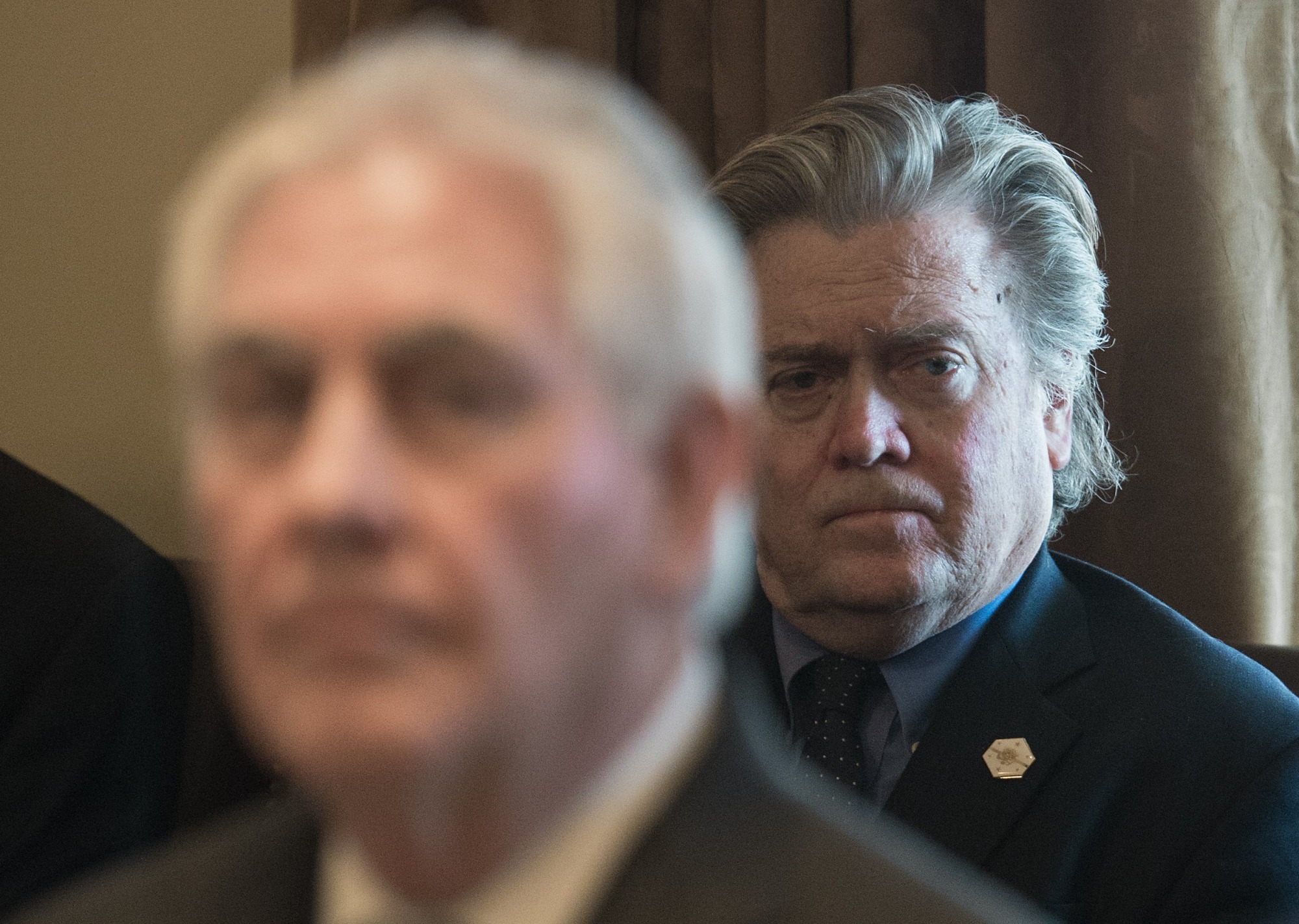 Senior White House adviser Steve Bannon (back) attends a meeting at the White House in Washington in March. | AFP-JIJI