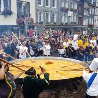 Members of the worldwide fraternity of the omelet prepare a traditional giant omelet made with 10,000 eggs in Malmedy, Belgium, Tuesday. | REUTERS