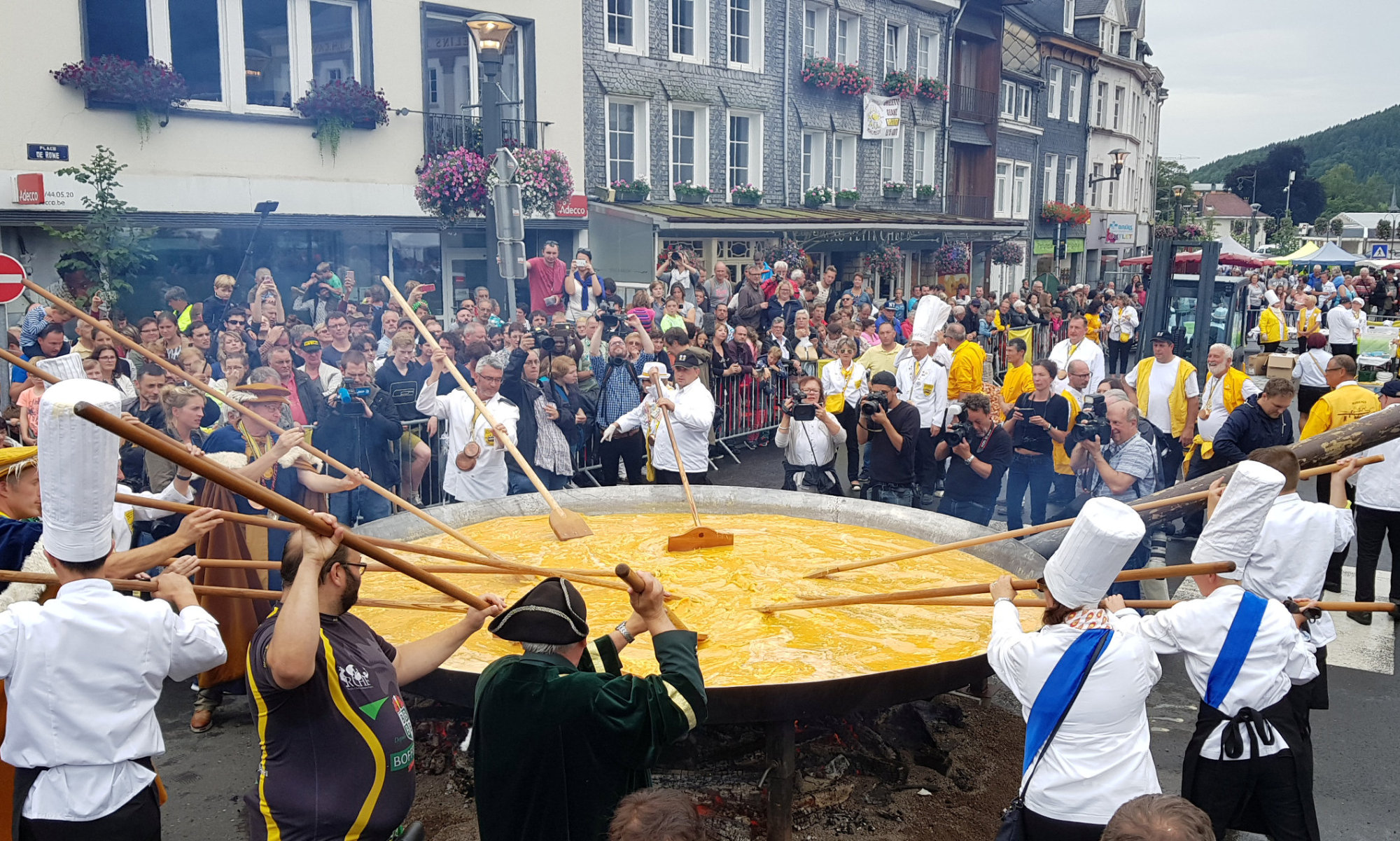 Members of the worldwide fraternity of the omelet prepare a traditional giant omelet made with 10,000 eggs in Malmedy, Belgium, Tuesday. | REUTERS