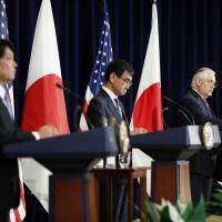 Facing reporters (from left) Defense Minister Itsunori Onodera and Foreign Minister Taro Kono listen as Secretary of State Rex Tillerson speaks during a news conference Thursday, at the State Department in Washington. | AP