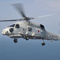 An SH-60J patrol helicopter like this one lost contact with the Maritime Self-Defense Force on Saturday while flying over the Sea of Japan off Aomori Prefecture. | MSDF / VIA KYODO