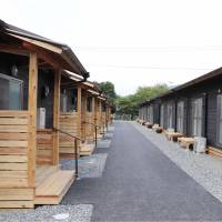 Temporary homes await residents in a school yard in Asakura, Fukuoka Prefecture, on Thursday morning. | KYODO
