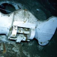 An image shot from a remotely operated underwater vehicle shows the bottom of an anchor marked \"U.S. Navy\" and \"Norfolk Navy Yard.\" | COURTESY OF PAUL G. ALLEN