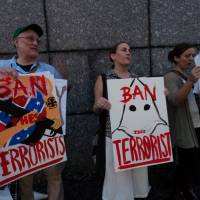Terror alert: American citizens attend the \"Enough is Enough\" rally near the U.S. Embassy in Toranomon, Tokyo, on Aug. 15, days after hate groups clashed violently with anti-fascist counterprotesters in Charlottesville, Virginia. | DAMON COULTER
