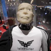 Modern look: A Mars Electric Inc. Teleporter humanoid robot sits on display during Slush Tokyo in March. The student-driven startup event is seeking to ignite the entrepreneurial spirit in Japanese youth. | BLOOMBERG