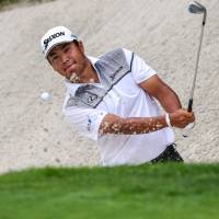 Hideki Matsuyama hits out of the sand on the 16th hole during the second round of The Northern Trust at Glen Oaks Club. | USA TODAY / VIA REUTERS